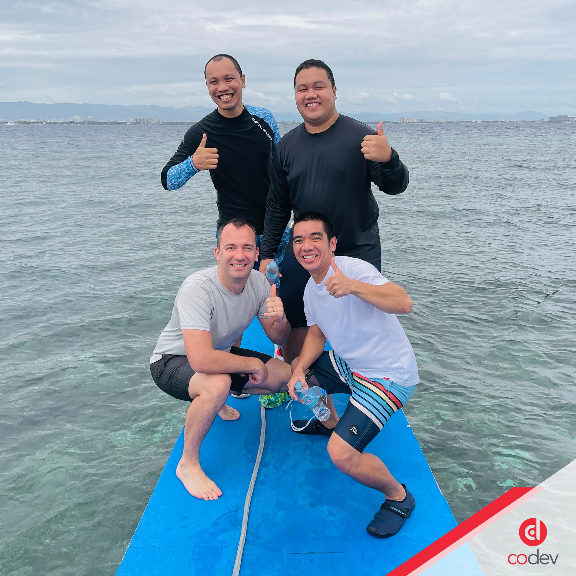 Landon with CoDev's developers in the Philippines